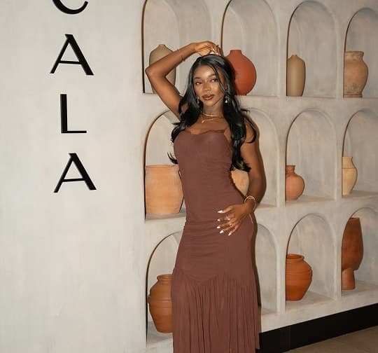 A guest in brown at the gallery wall