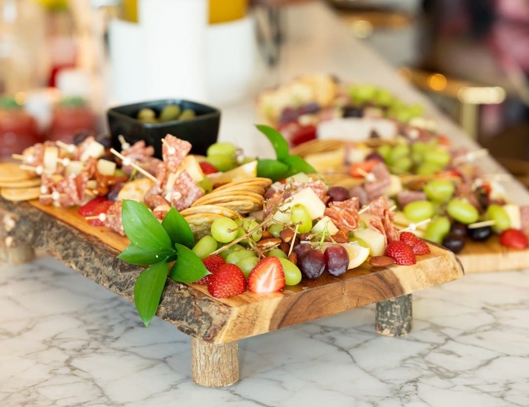 A charcuterie board on a marble counter